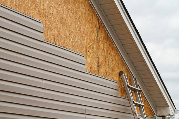 Professional Vinyl Siding technician working in Levittown, PA